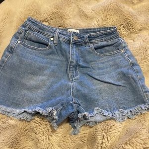 Jean shorts that are super cute and long, the stings don’t go up either!!